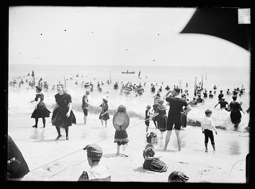 Children playing with rope at beach, possibly Atlantic City, N.J.