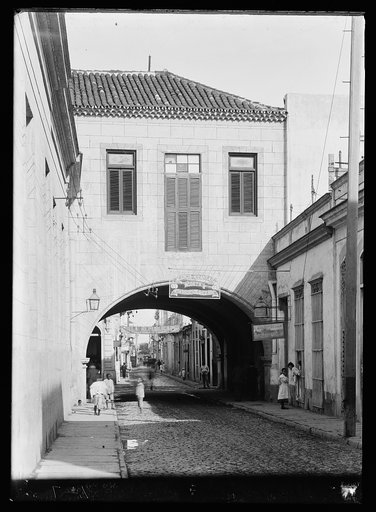 Calle Acosta, alley with building arch, Havana, Cuba