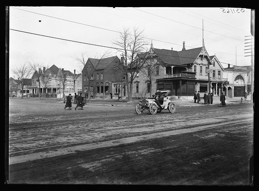 Street with automobile and Moesta's store