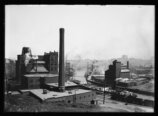 Industrial buildings, including Stowe-Fuller Company warehouse and Henkel's Flour mill, along the Cuyahoga River, Cleveland, Ohio