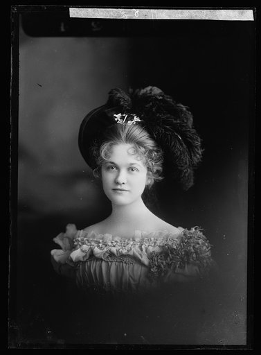 Louise Jackson in plumed hat, head and shoulders portrait