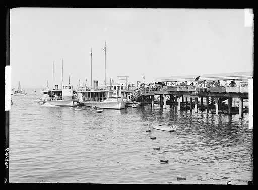 Side wheelers Cleopatra and Empress at pier, Catalina Island, Calif.
