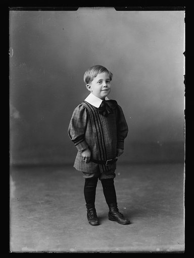 Boy in knickers, full-length portrait