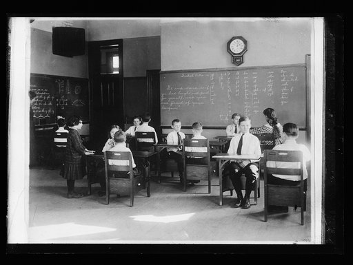 Classroom interior with students and blackboard