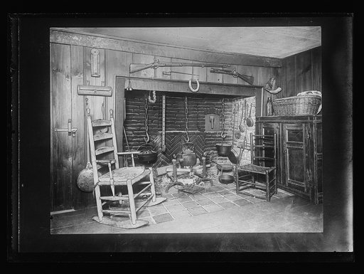 Colonial-style interior with fireplace and rocking chair