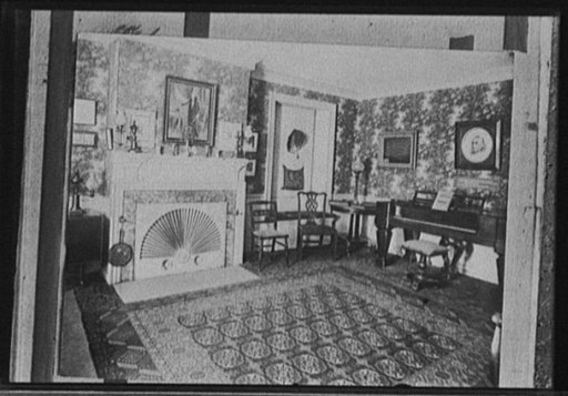 Living room with portrait of George Washington over fireplace