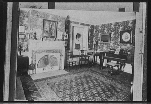 Living room with portrait of George Washington over fireplace