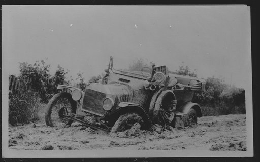 Car mired in mud