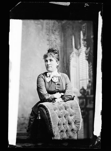 Emilie Painter Jackson, three-quarter-length portrait posed against chair