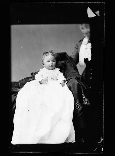 Baby in christening gown