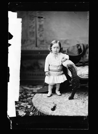 Girl, posed by chair