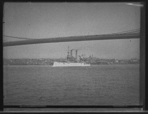 U.S.S. Iowa passing under Brooklyn Bridge