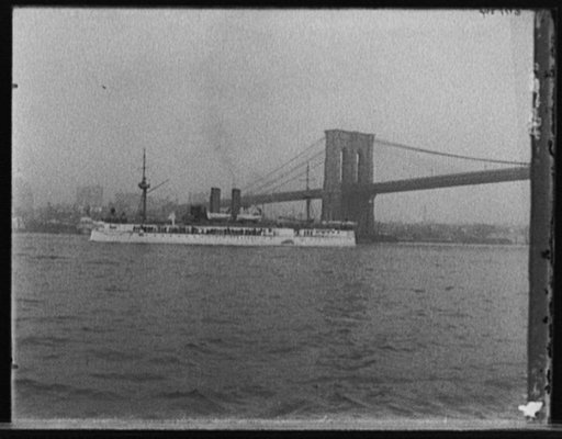 Maine passing under Brooklyn Bridge