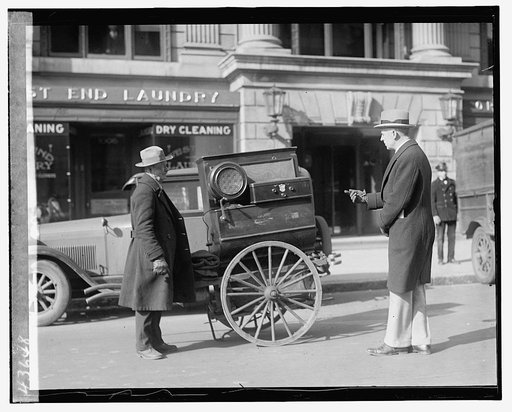 Street scene: men and cart near laundry