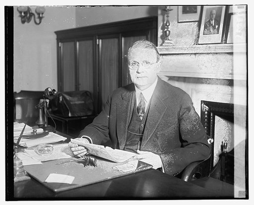 Unidentified man, seated at desk