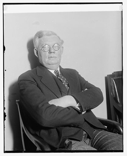 Unidentified man, seated