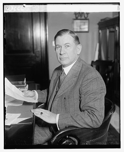 Senator Alben W. Barkley, seated at desk