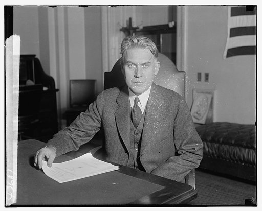 Unidentified man, seated at desk