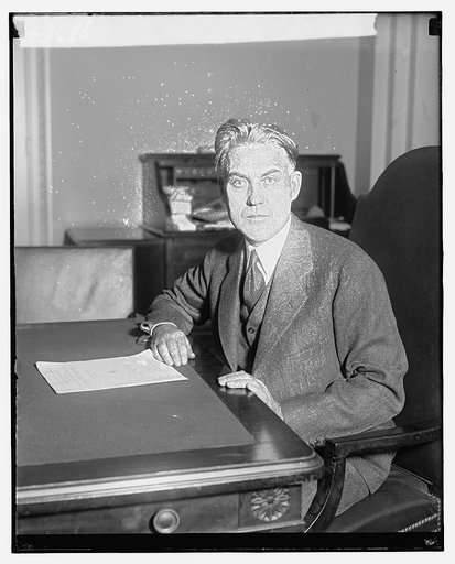 Unidentified man, seated at desk