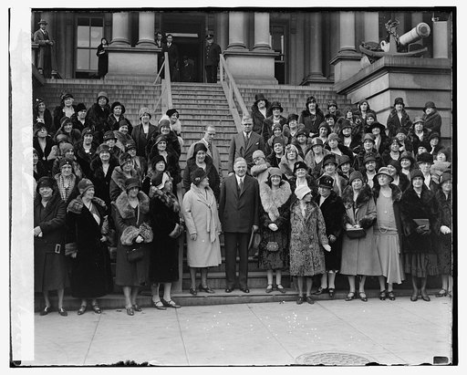 President Herbert Hoover (center) with group, on the steps of the State, War, and Navy Building, Washington D.C.