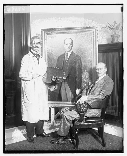 Unidentified painter and man seated near portrait