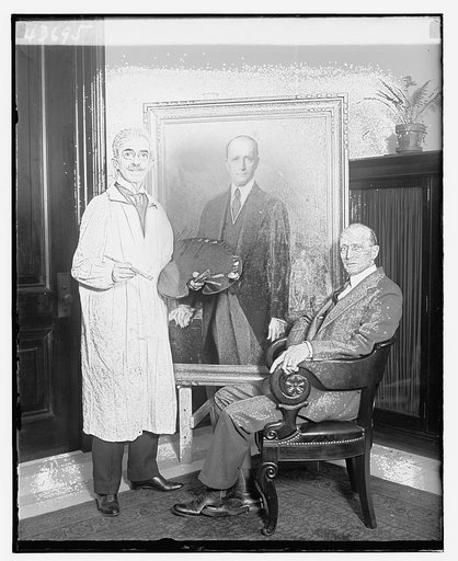 Unidentified painter and man seated near portrait