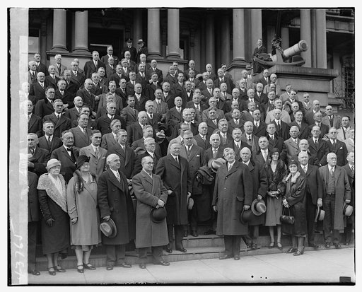 President Herbert Hoover (center) with group, on the steps of the State, War, and Navy Building, Washington D.C.