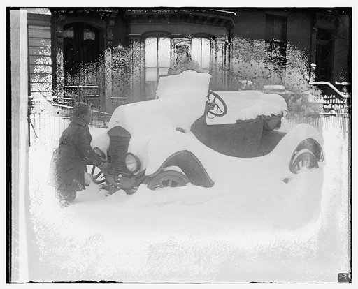 Automobile covered in snow