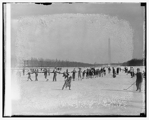 People ice skating, Washington Monument in background
