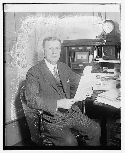 Unidentified man seated at desk