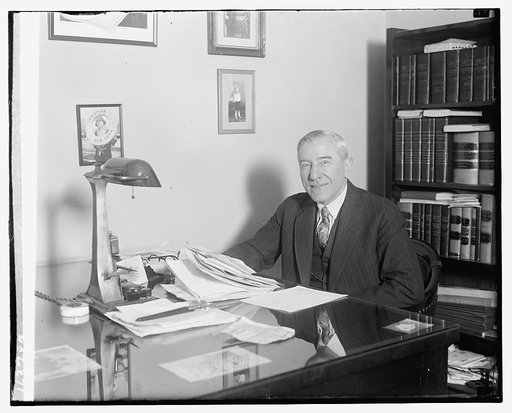 Unidentified man seated at desk