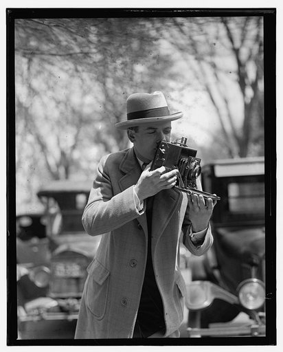 Unidentified photographer with camera
