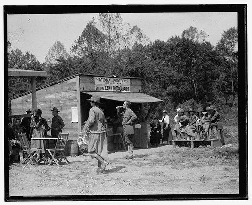 Shed building with sign: "National Photo Co., 815 H St., N.W., Official Camp Photographer"