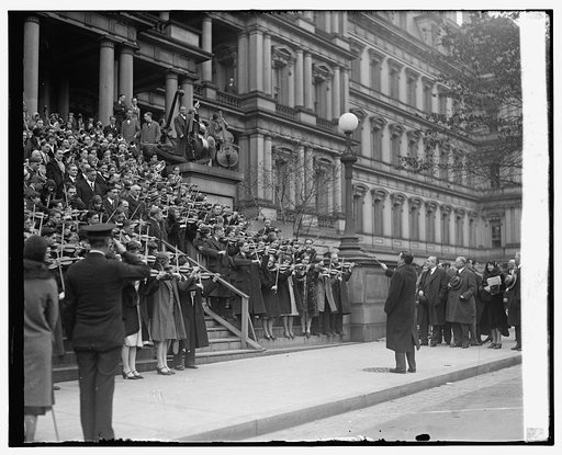 Violinists on steps of State, War, Navy building