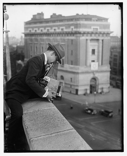 Unidentified photographer with camera
