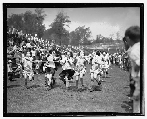 Children in race crossing finish line