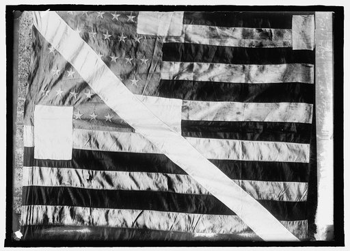 Flag raised as the North Pole by Peary