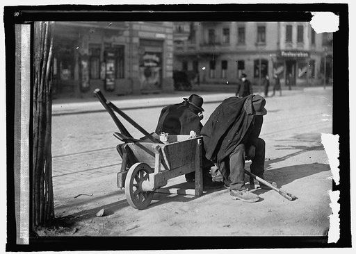 Germany. Street sweepers taking lunchtime nap