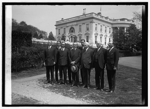 Coolidge and group outside White House, Washington, D.C.