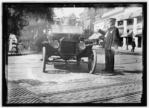 Herbert E. French in Ford stopped by traffic cop