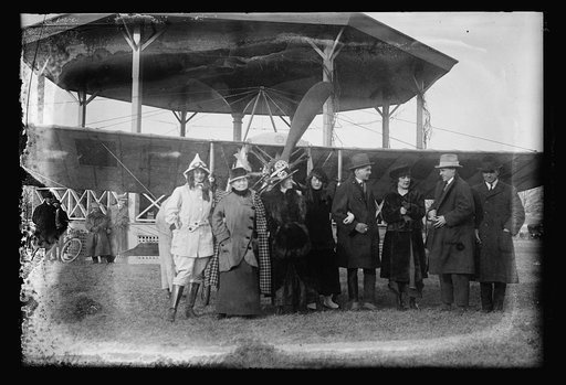 Group next to airplane
