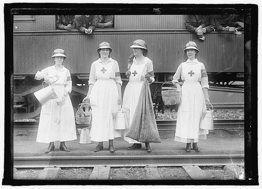 Red Cross workers near train