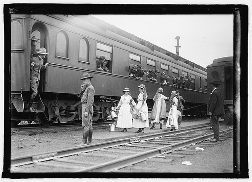 Red Cross workers near train