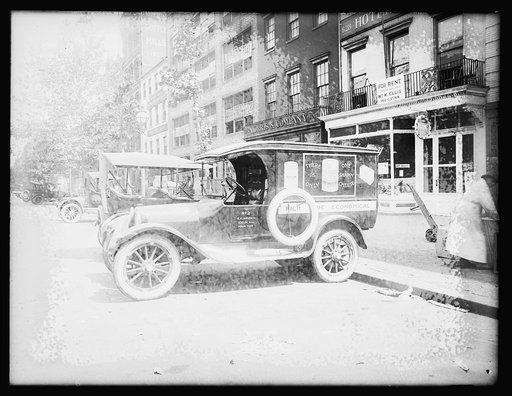 Automobile with ad for Shefford's Snappy Cheese