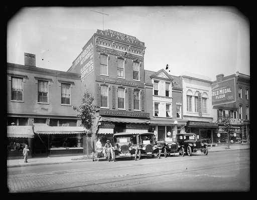 Cars parked outside electrical and atuo supply shops
