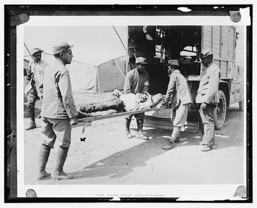 Wounded man on ambulance stretcher