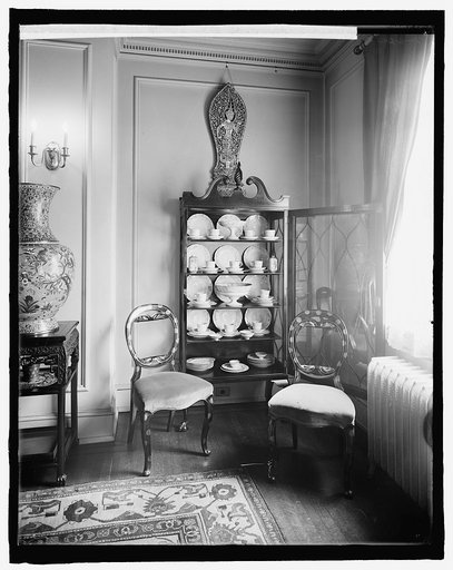 Home interior, china cabinet and chairs