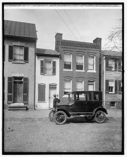 Ford Motor Co., Ford Coupe at little house in Alex., Va.