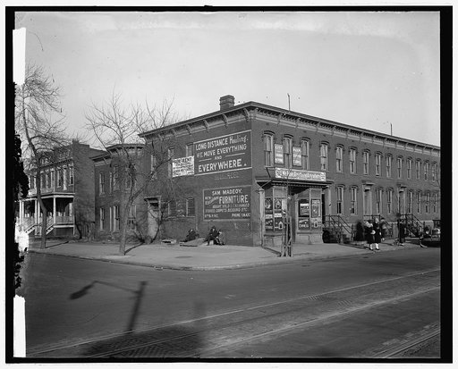 Street scene, rowhouses and moving company, Washington, D.C.