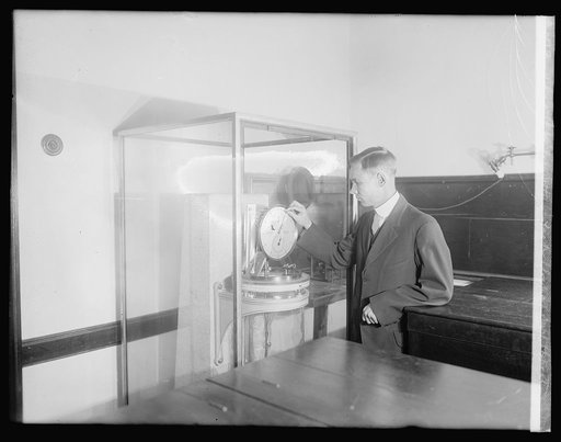 Chas. C. Wylie setting back clock at Naval Operatory